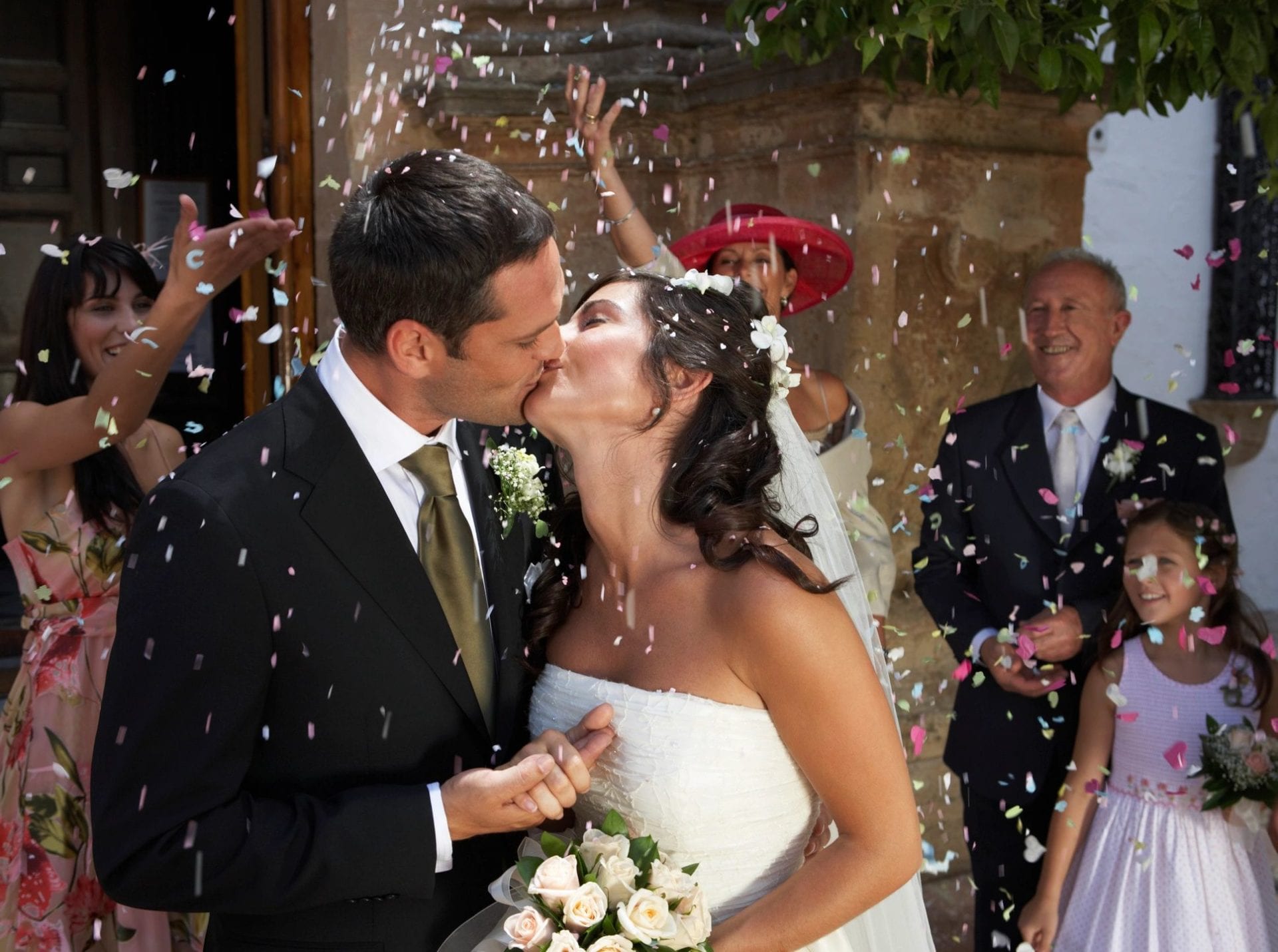 Bride and groom kissing each other